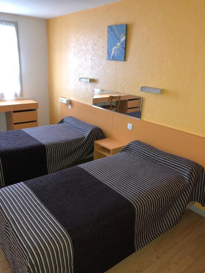 Quarto com 2 Camas de Solteiro